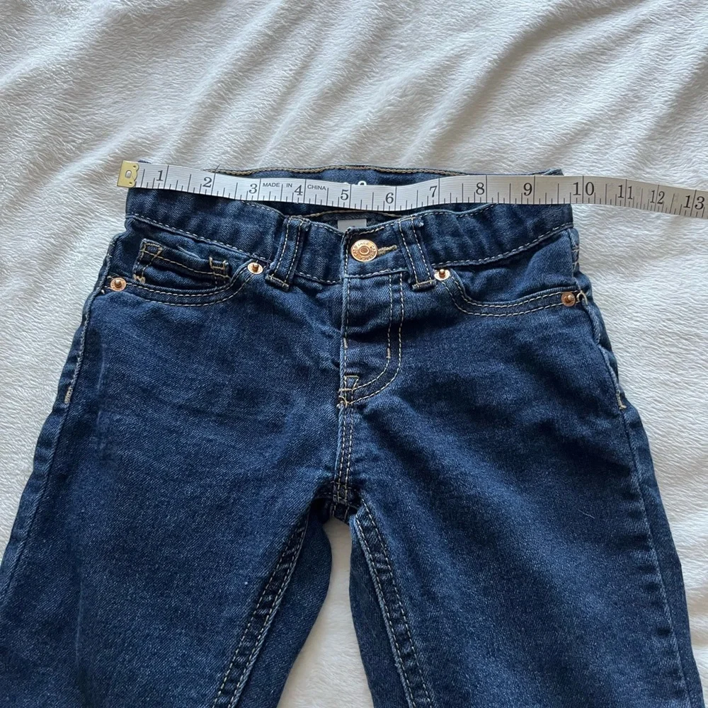 Cat & Jack kids blue jeans size 4T. Gold stitching around pockets.